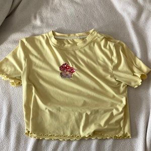 Yellow mushroom crop top, length: 1.4ft, width: 1.3ft